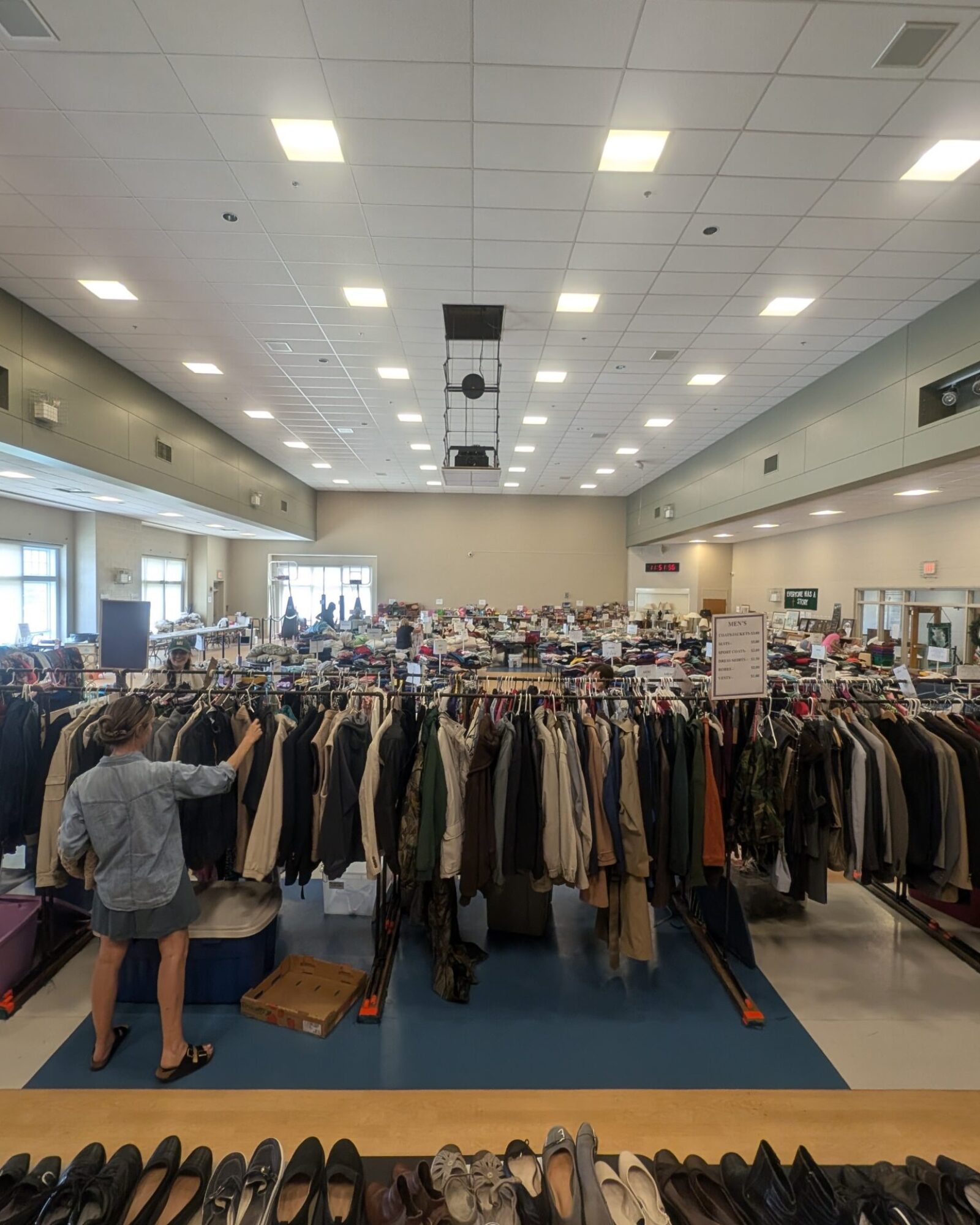 woman browsing clothing racks