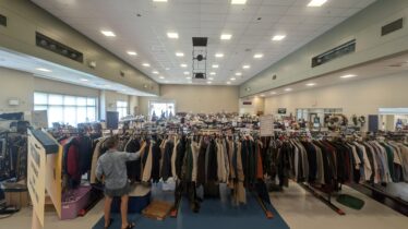 woman browsing clothing racks